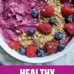A healthy vegan smoothie bowl recipe using frozen fruit as a base with fresh toppings.