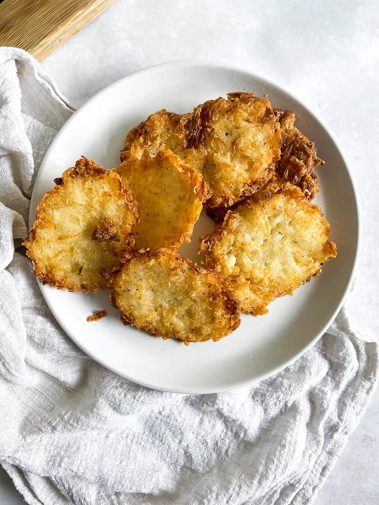 A white bowl of copycat homemade McDonald's hash browns.