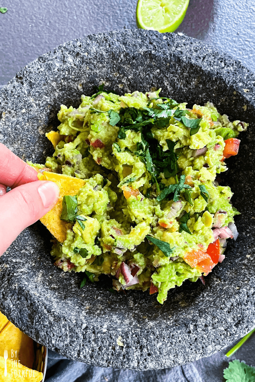 guacamole in a bowl with tortilla chips