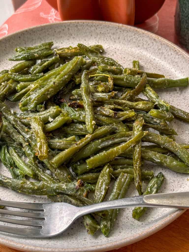 a close up shot of the roasted frozen green beans