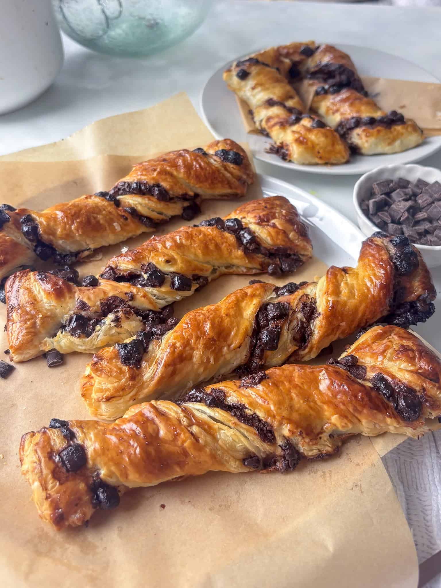 a close up shot of a plate of chocolate twists