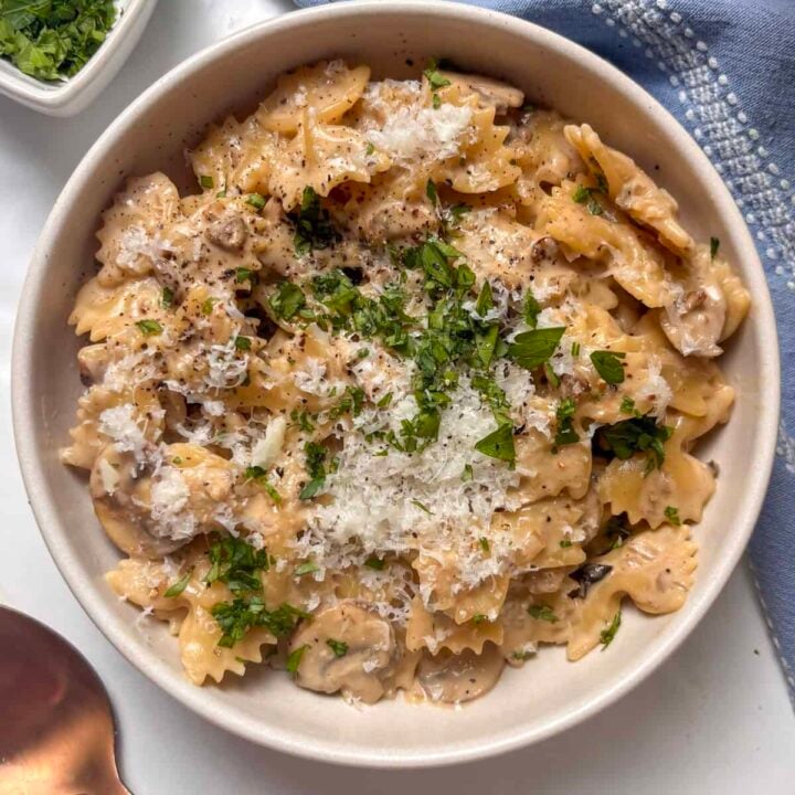 creamy mushroom pasta topped with pecorino cheese and diced parsley