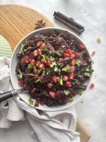 braised red cabbage topped with pomegranate and parsley