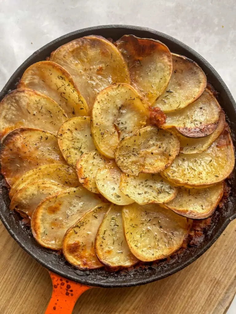 another overhead shot of this vegan lentil hotpot topped with crispy sliced potato