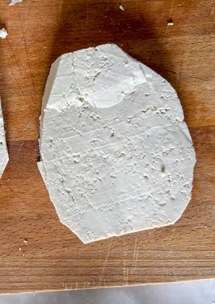 an oval shaped slice of tofu