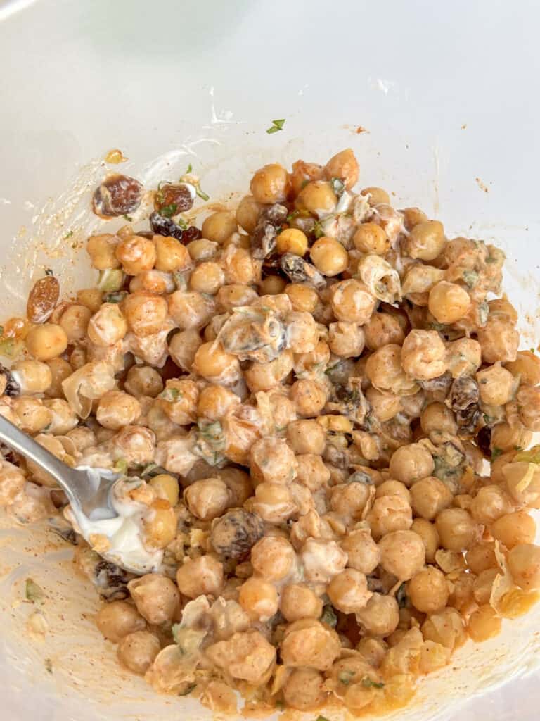 the coronation chickpea ingredients mixed together in a mixing bowl