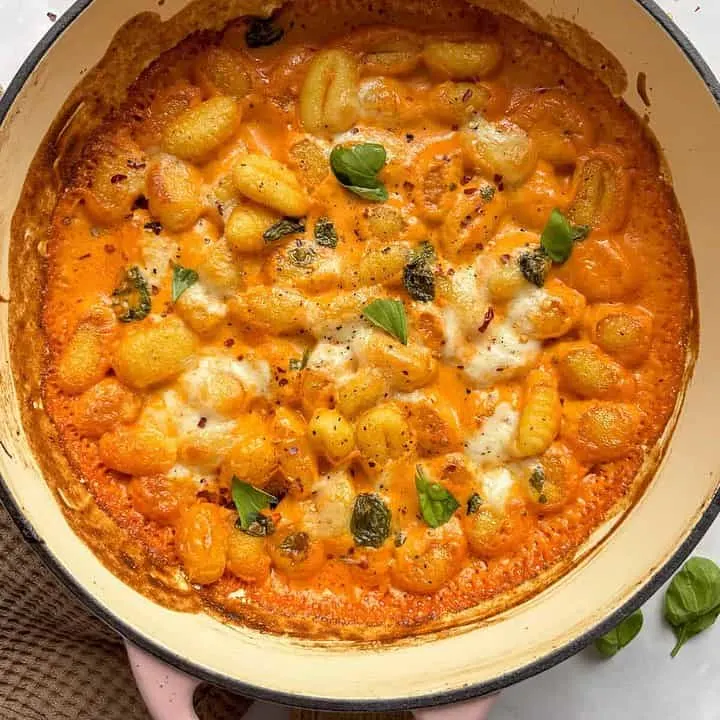 overhead shot of gnocchi with vodka sauce baked with mozzarella