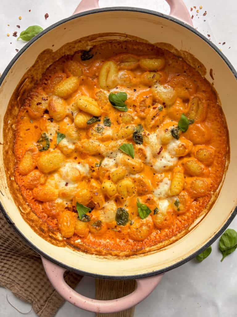 overhead shot of gnocchi with vodka sauce baked with mozzarella