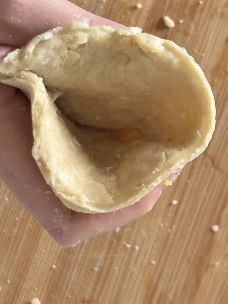 an overhead shot of the cone-shaped dough held in my hand, where we'll put the filling