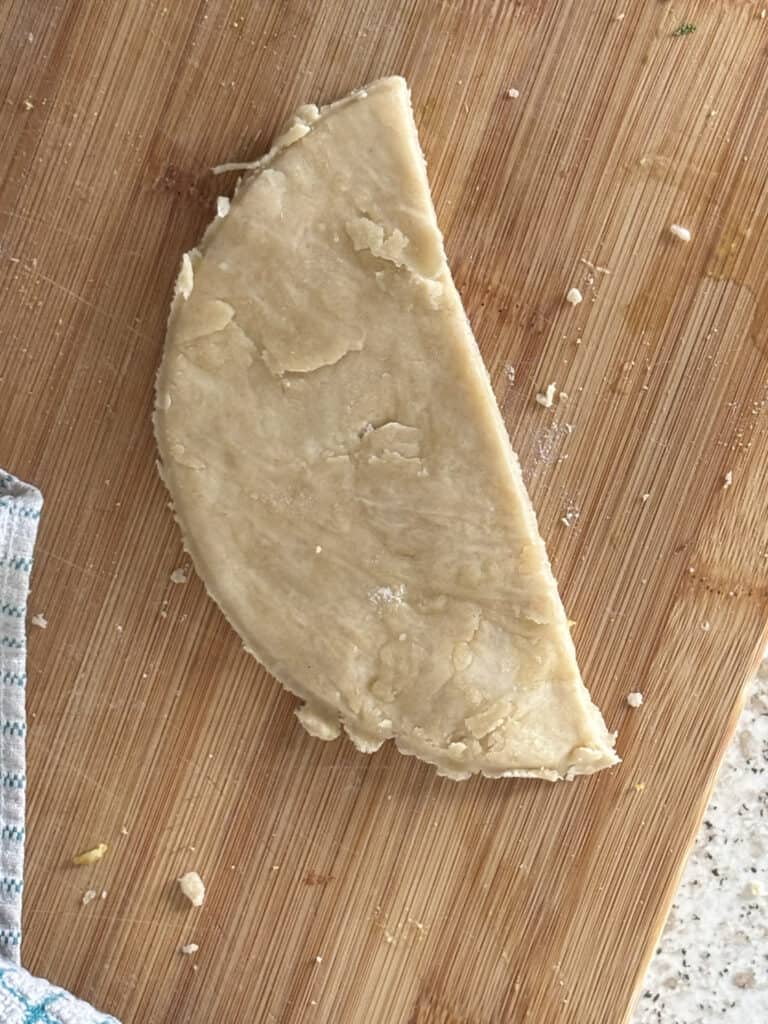 another shot of a single half-circle shaped piece of dough
