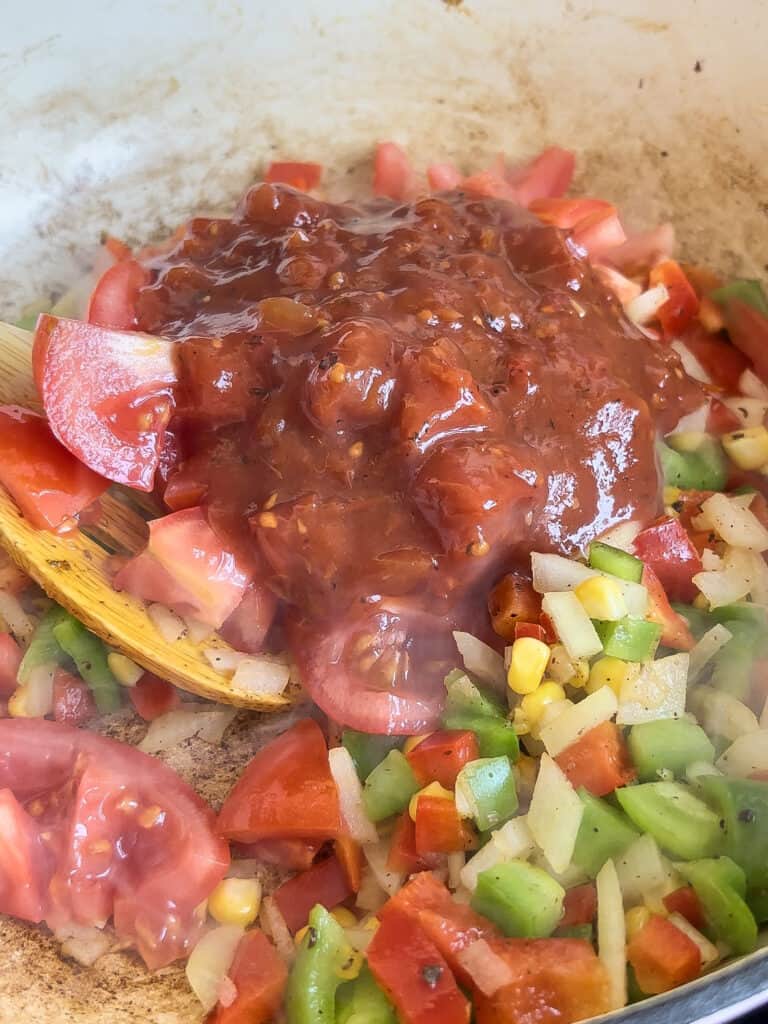 fresh tomatoes and salsa added to the pan with the other vegetables