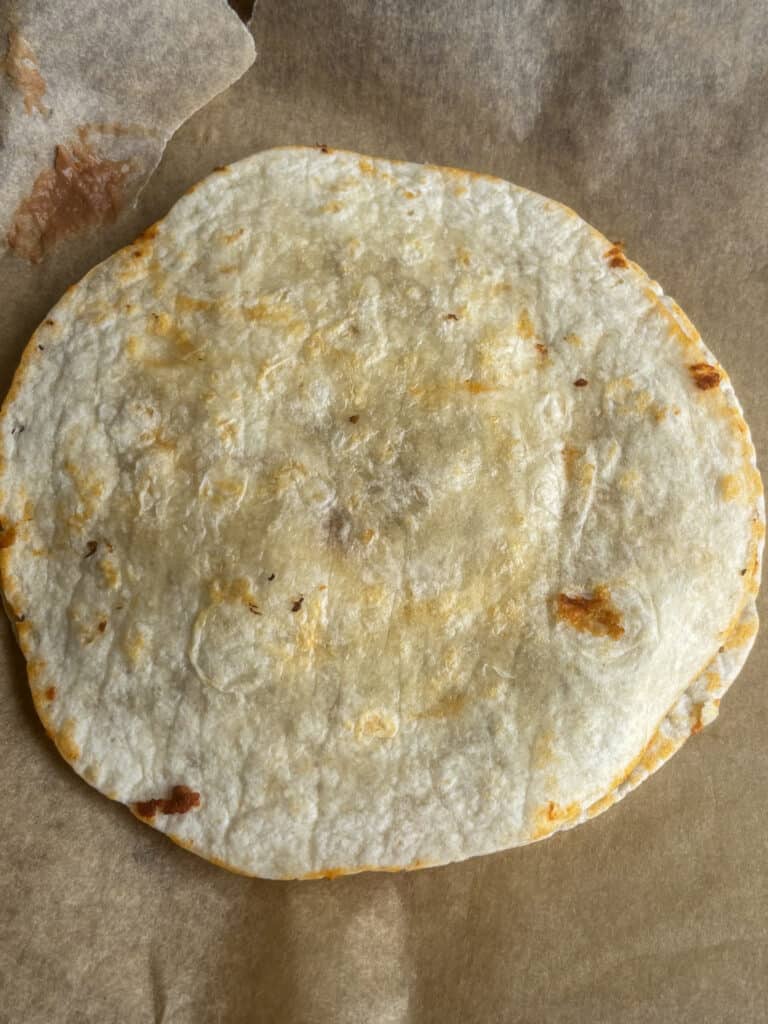 Mexican pizza with mini tortilla wrap on top