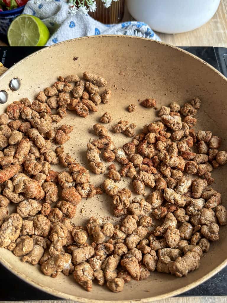 mince added to a saucepan with mexican seasonings