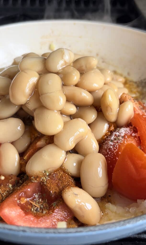 jarred butter beans and their stock are also added to the casserole dish