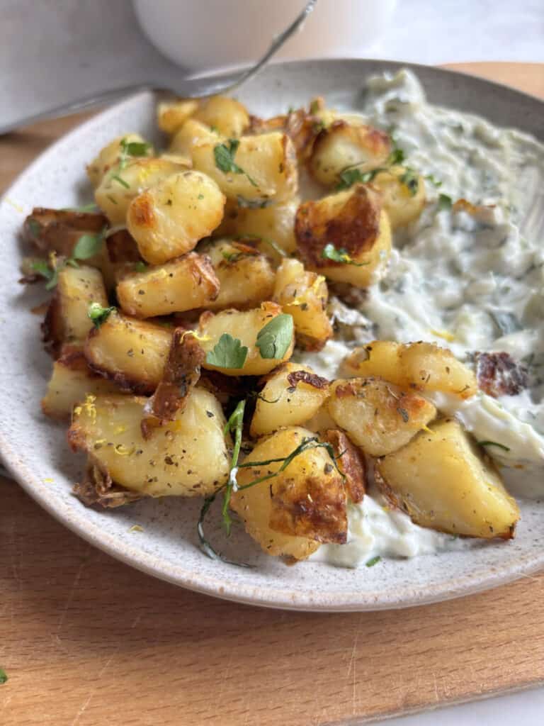 dill roasted potatoes with lemon zest and cilantro, close up image