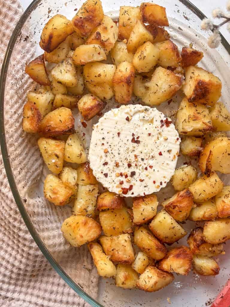 the assembled potatoes and feta block before baking