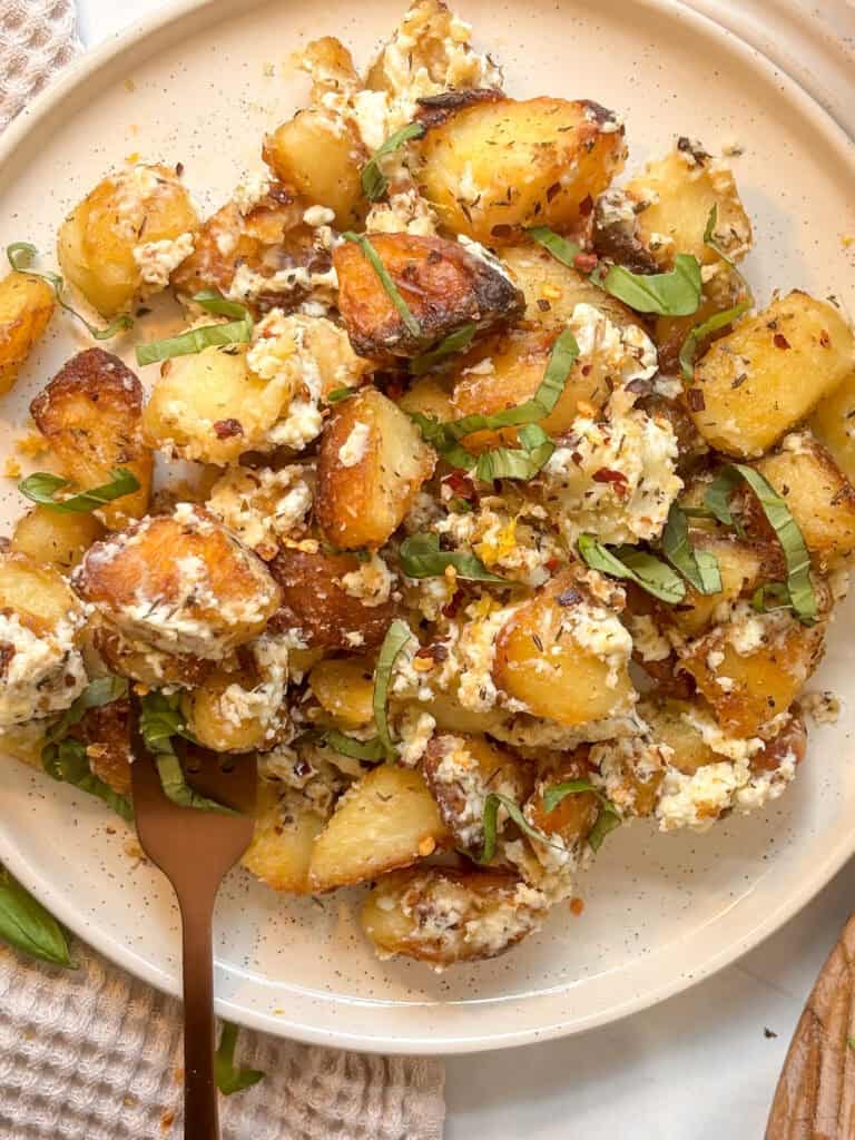 baked feta potatoes with red chilli flakes and basil