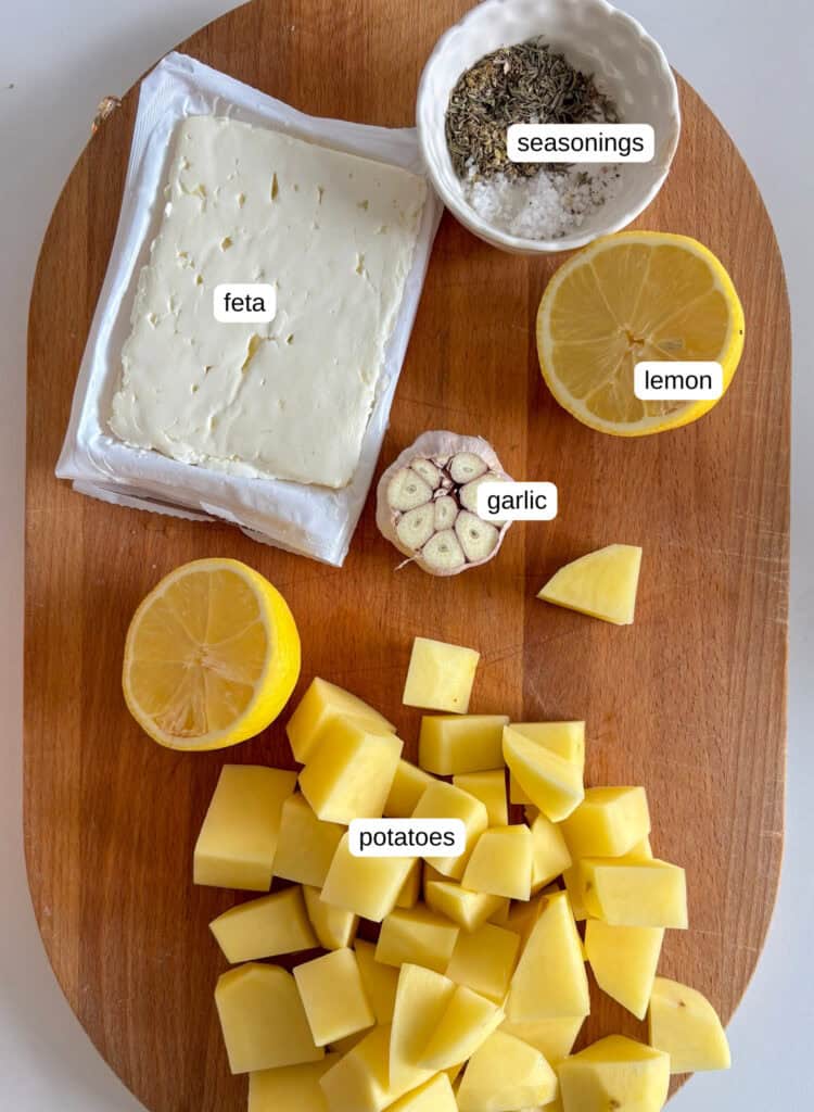 baked feta potatoes ingredients: feta, salt and pepper, thyme, oregano, lemon, garlic, and potatoes!