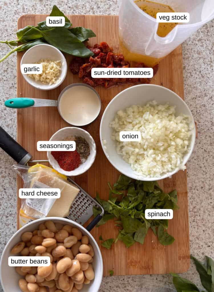 marry me butter beans ingredient shot: sun-dried tomatoes, stock, garlic, basil, onion, cream, seasonings, spinach, hard cheese, butter beans