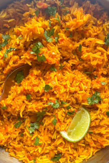 a pan of homemade nando's spicy rice topped with fresh herbs
