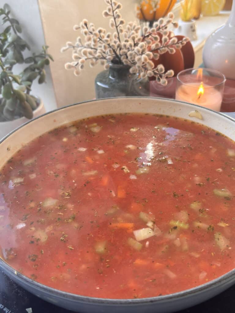 vegetable stock poured into the casserole pan