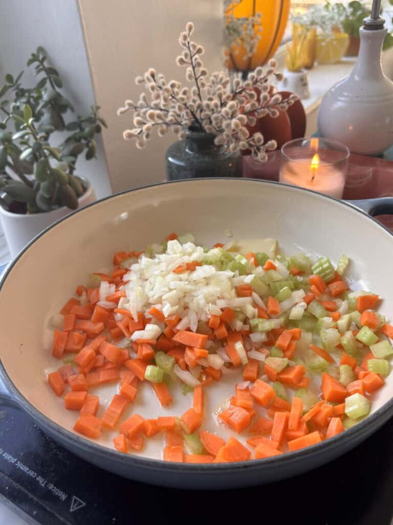 diced carrots, onion, and celery added to a casserole dish