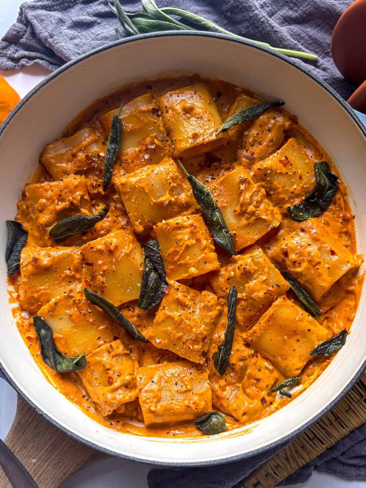 pumpkin pasta alla vodka with fried sage leaves topped with pepper and red pepper flakes