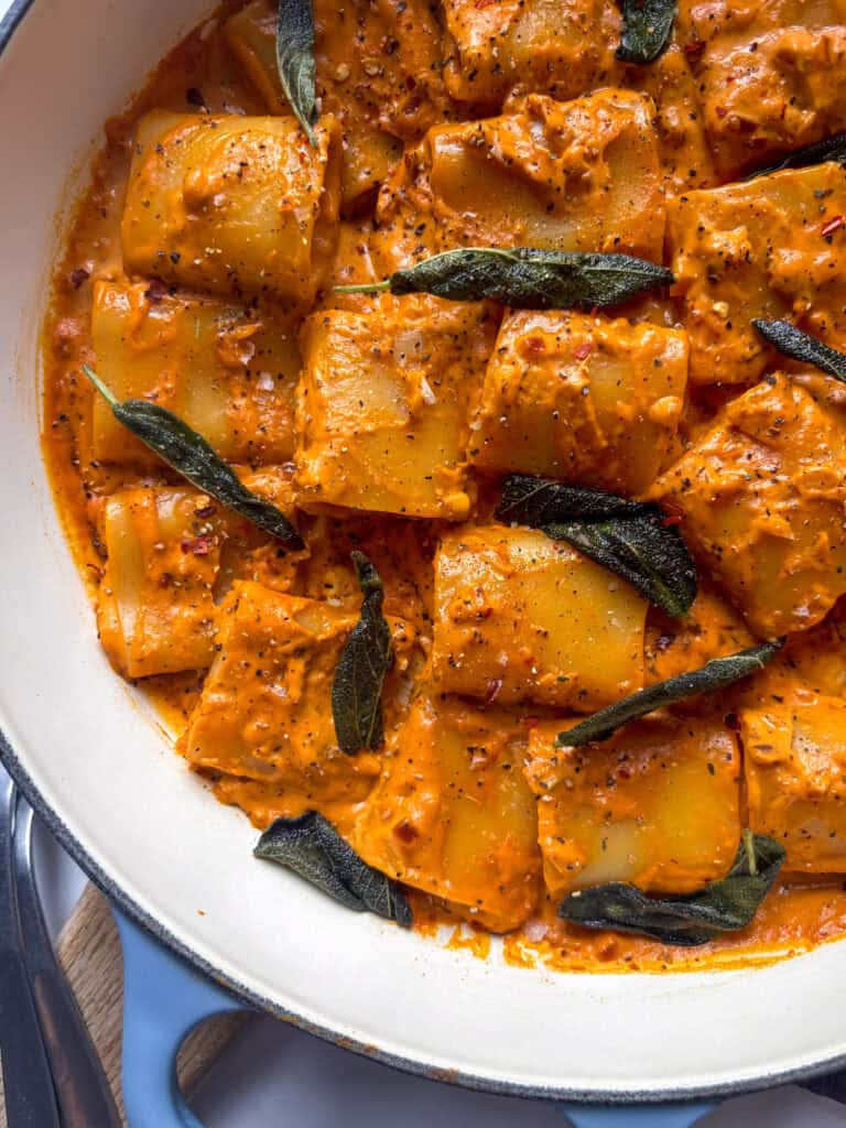 pumpkin pasta vodka close up shot, with crispy sage leaves