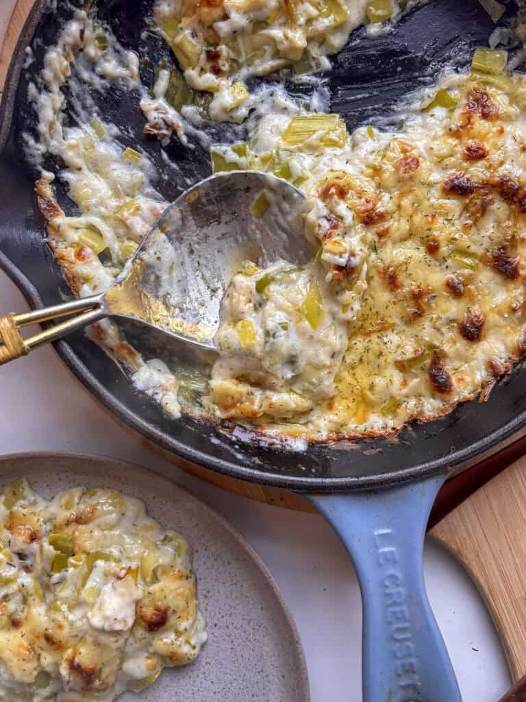 cheesy creamed leeks baked and grilled until golden, crispy, and bubbly