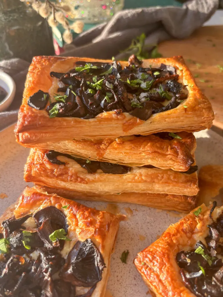 a stack of cheesy puff pastry tarts