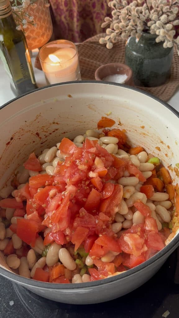 add seasonings, tomatoes, and white beans