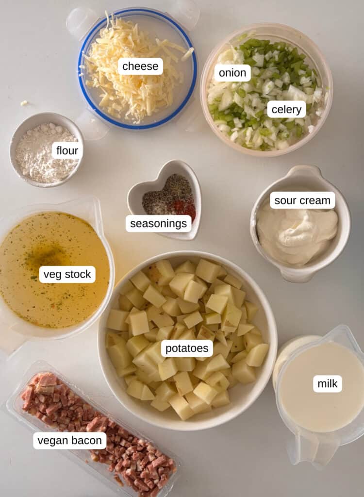 ingredients needed for loaded baked potato soup: onion, celery, garlic, flour, sour cream, seasonings, vegetable stock, potatoes, milk, vegan bacon, cheese, chives