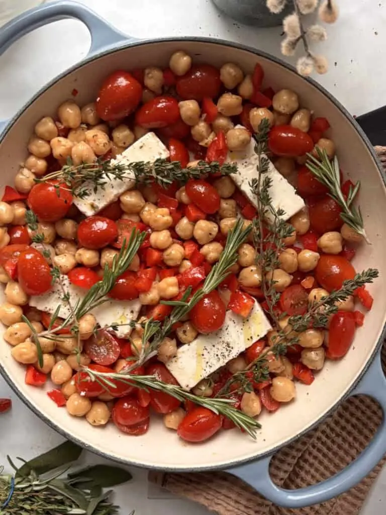 the feta, tomato, chickpea dish with herbs ready to be cooked