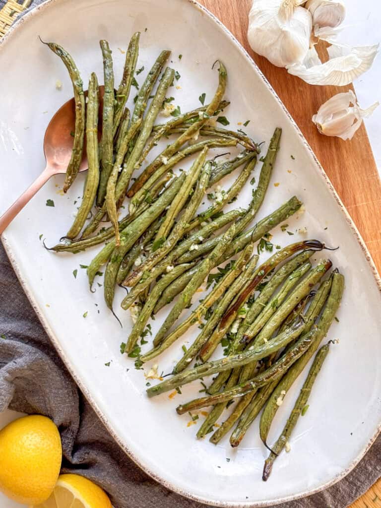 a serving plate of crispy roasted green beans