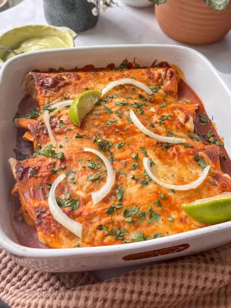 a tray of cooked black bean enchiladas
