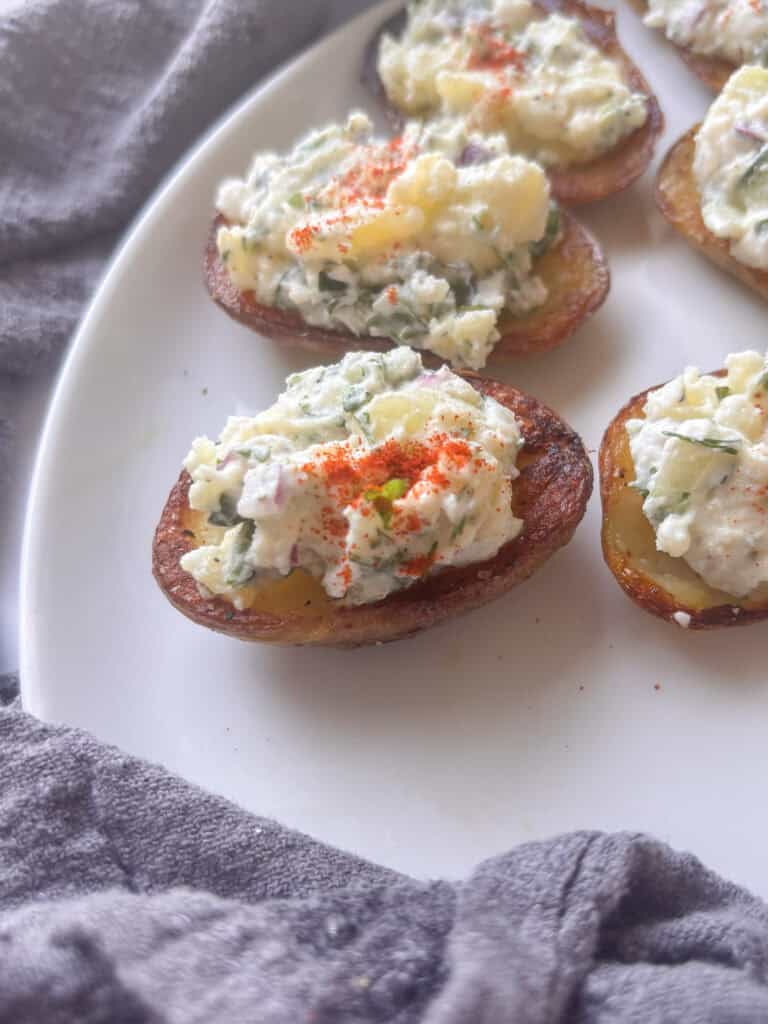 a close up of a devilled potato topped with paprika