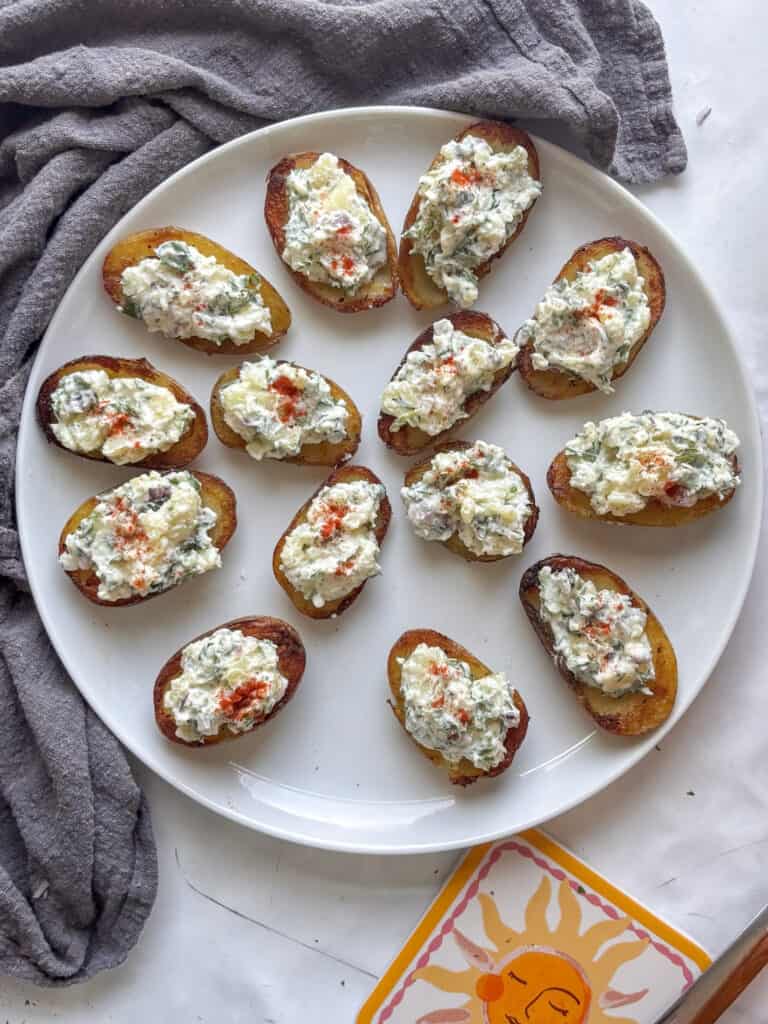 a plate of devilled potatoes topped with paprika