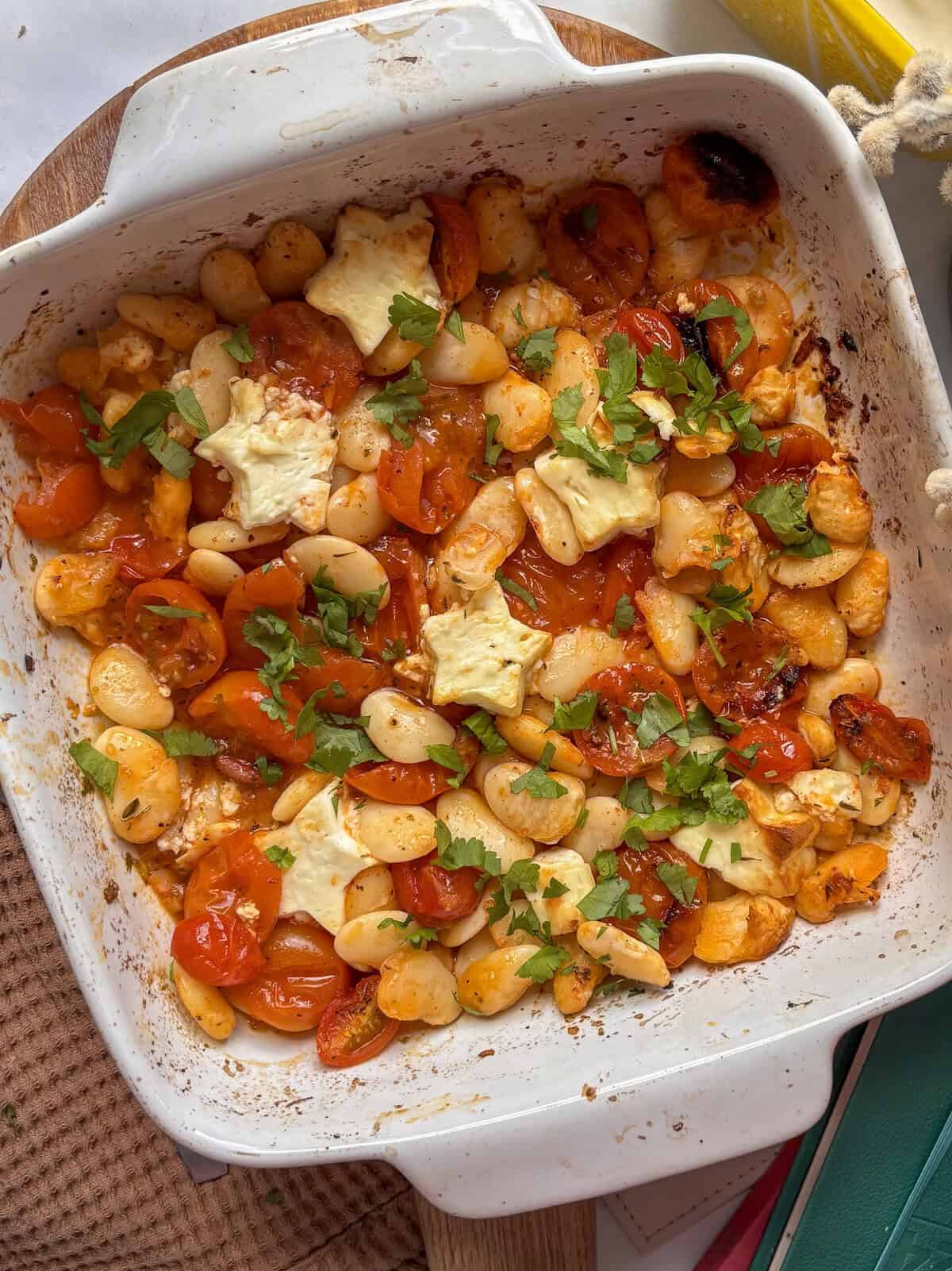 a baking dish of baked feta butter beans