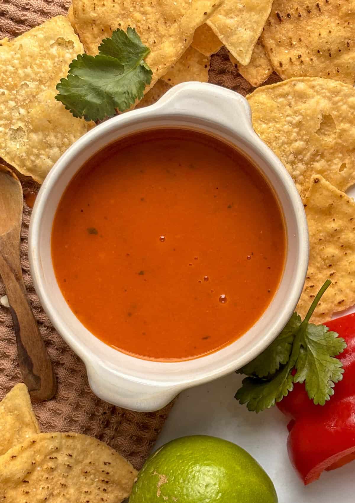 enchilada sauce surrounded by tortilla chips