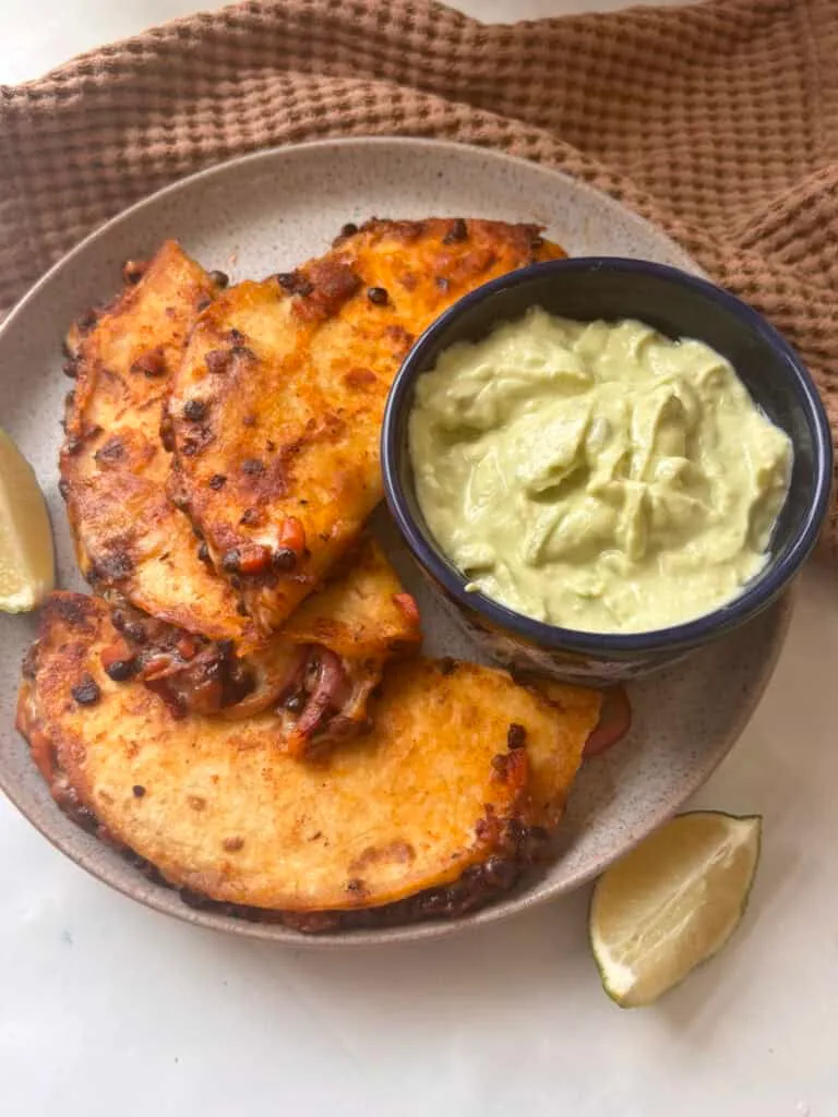 lentil taco meat tacos with cheese and avocado lime crema