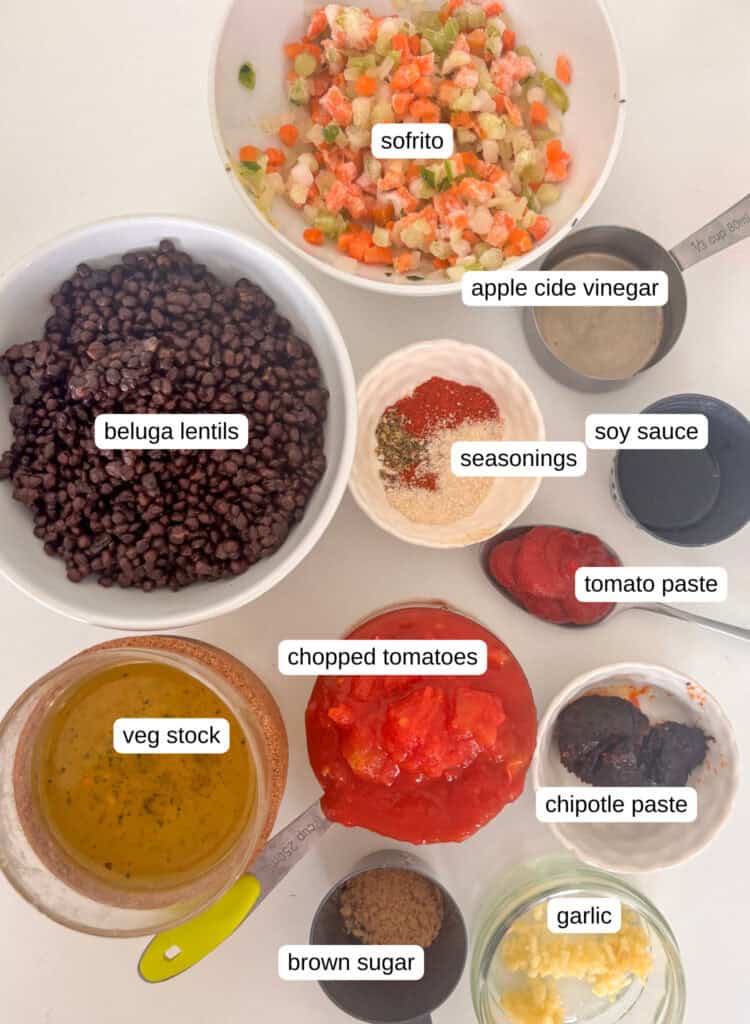 lentil taco meat ingredients - lentils, sofrito, apple cider vinegar, soy saucde seasonings, tomato paste, chopped tomatoes, veg stock, chipotle paste, brown sugar, garlic