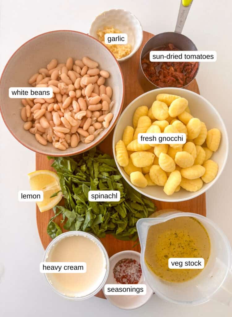 marry me gnocchi ingredients photo: gnocchi, sun-dried tomatoes, garlic, white beans, lemon, spinach, veg stock, heavy cream, basil, seasonings, lemon