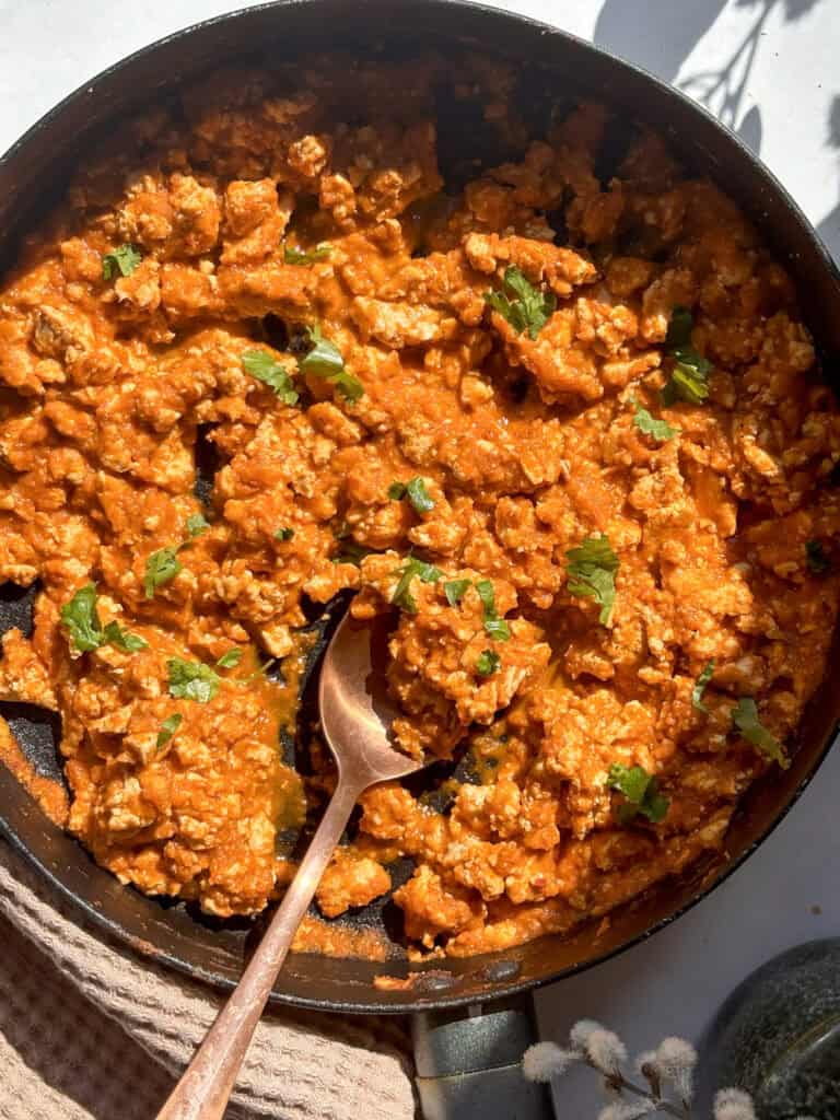 sunny tofu sofritas in a pan, topped with fresh cilantro