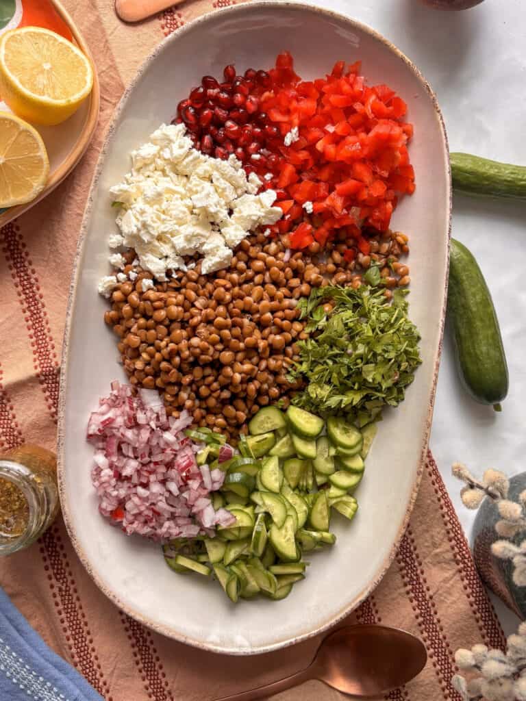 the lentil salad before being tossed - with ingredients added to a serving platter