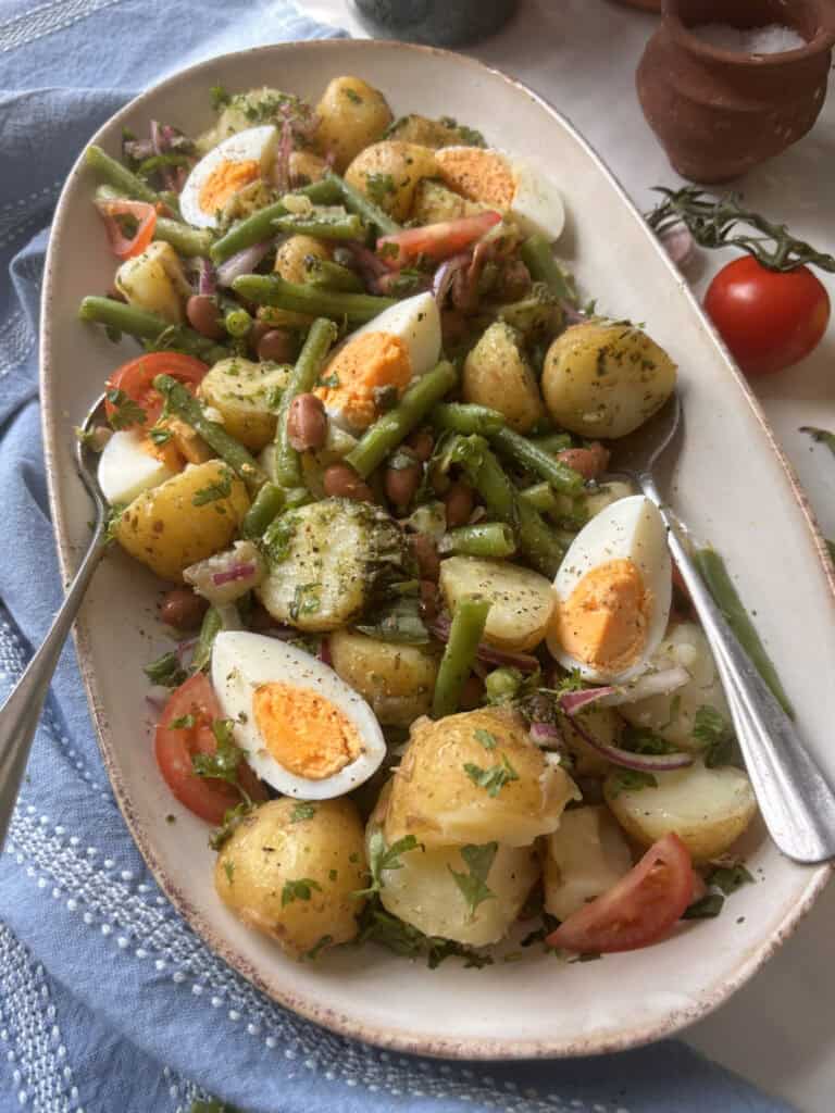 potato and green bean salad on a serving plate