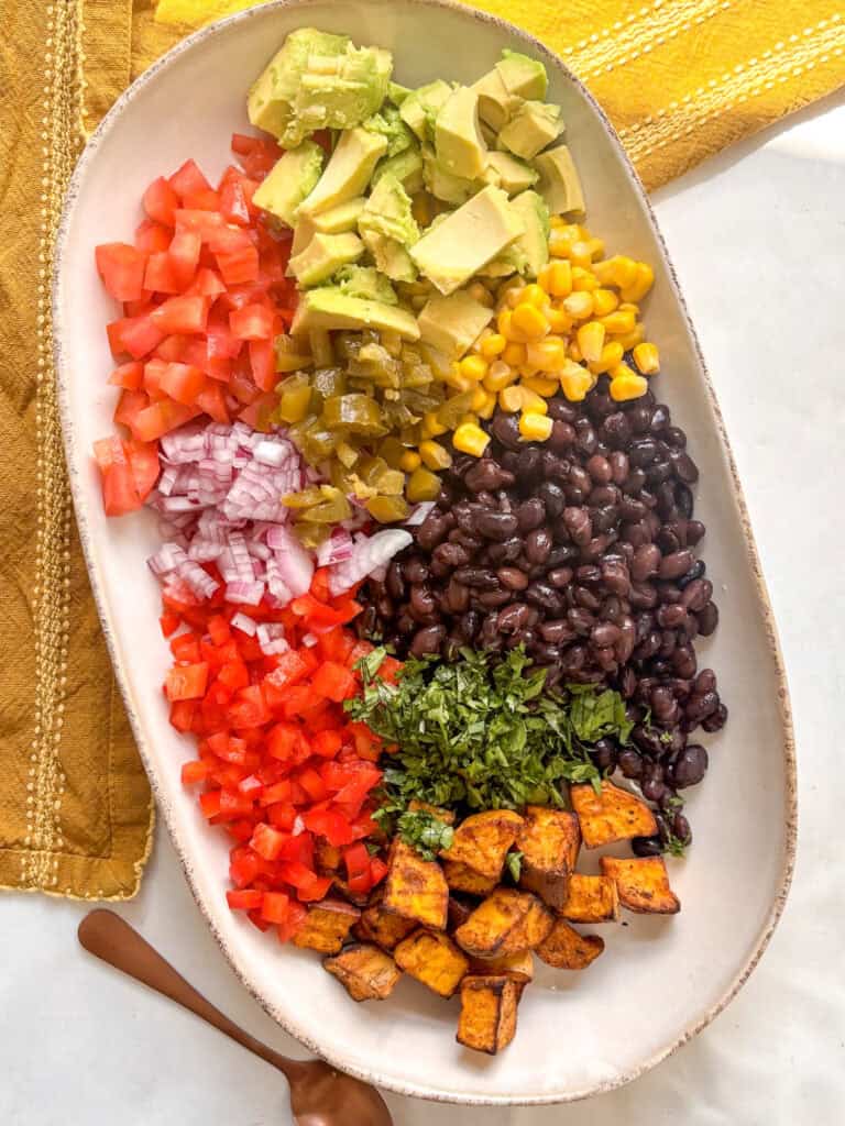 the high protein black bean salad with ingredients placed separately readdy to be mixed