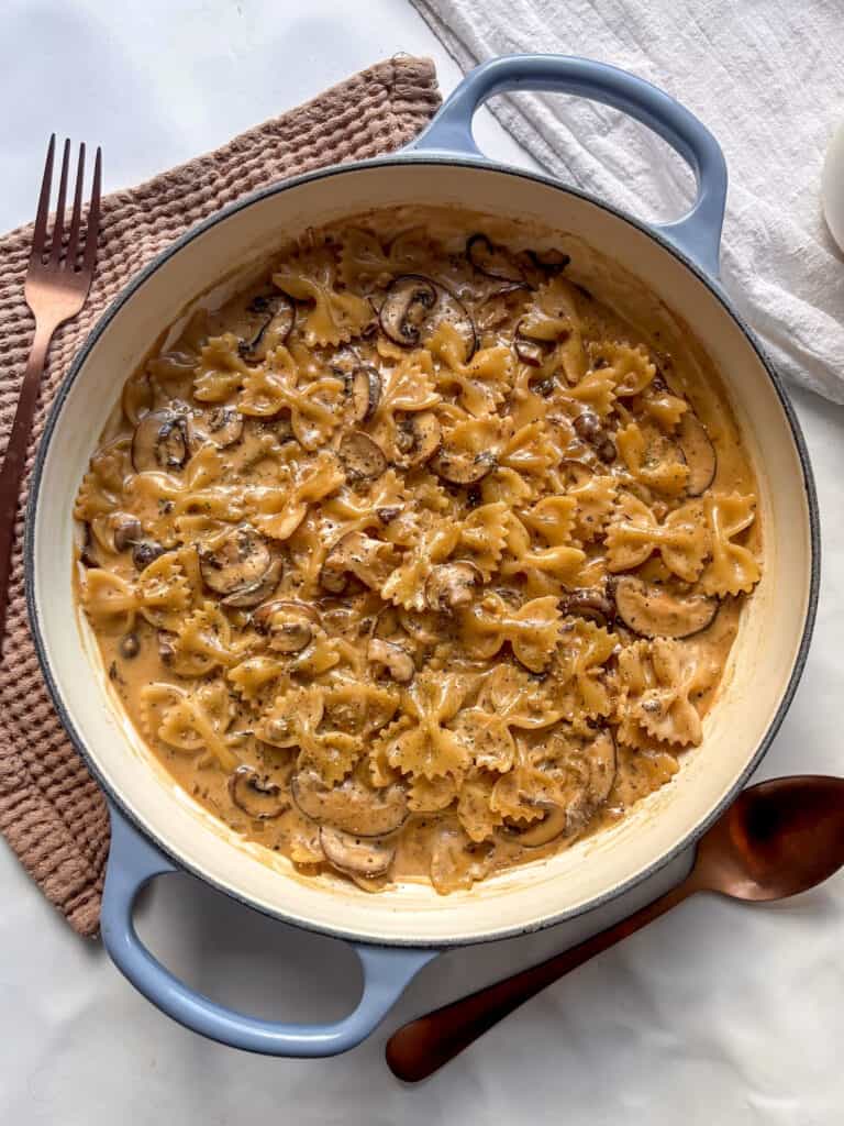 a casserole dish of creamy marmite mushroom pasta