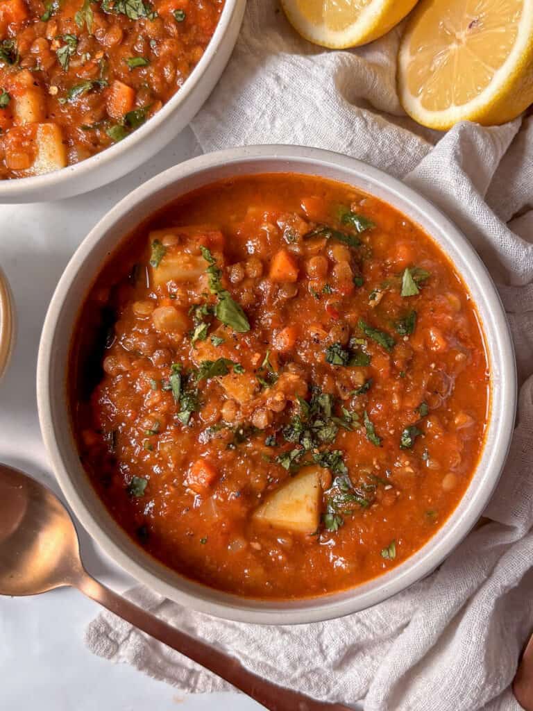 cozy lentil soup with vegetables, lemon, and parsley