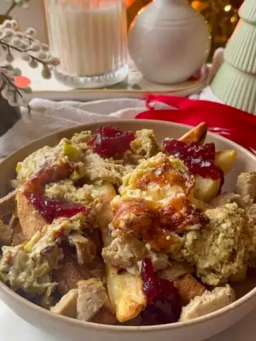 christmas chips - thick-cut chips loaded with cheesy leeks, stuffing, chicken roast, cranberry sauce, and gravy