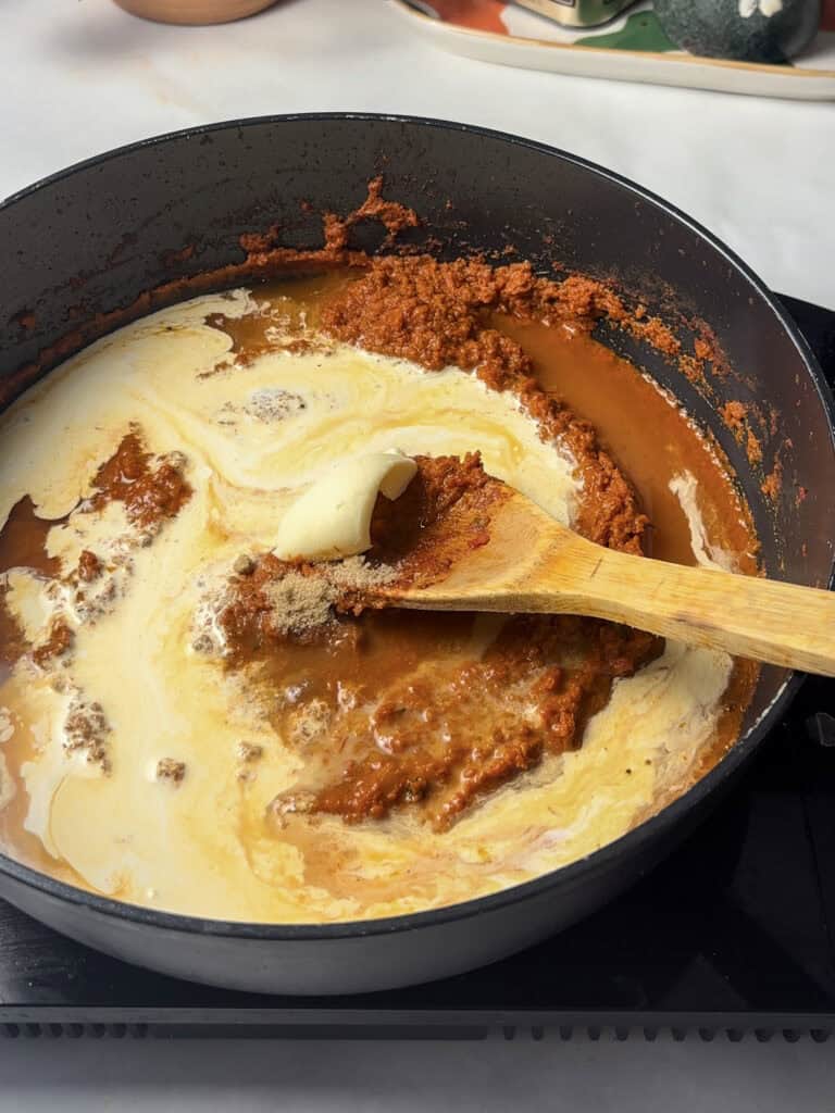 masala sauce with the cream, water, butter, and sugar added, pre-stirring